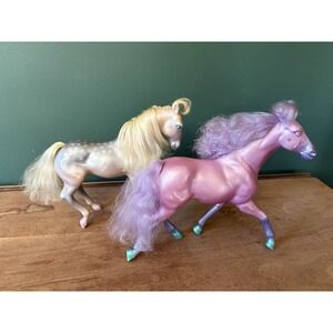 pair of vintage Kenner Fashion Star Fillies horse figures from the 1980s